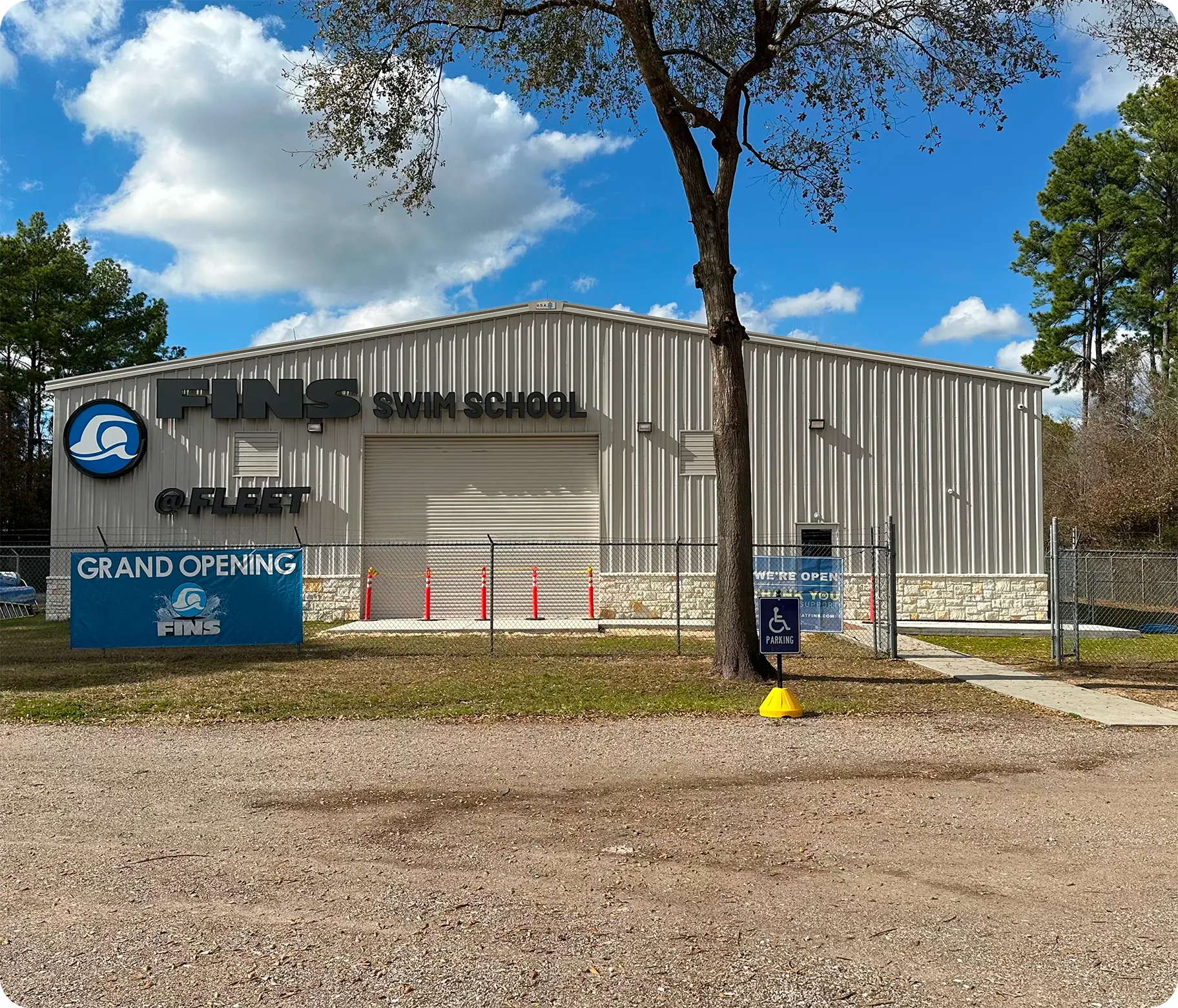 A student and instructor practicing professional swim techniques in the Spring, TX, indoor facility.