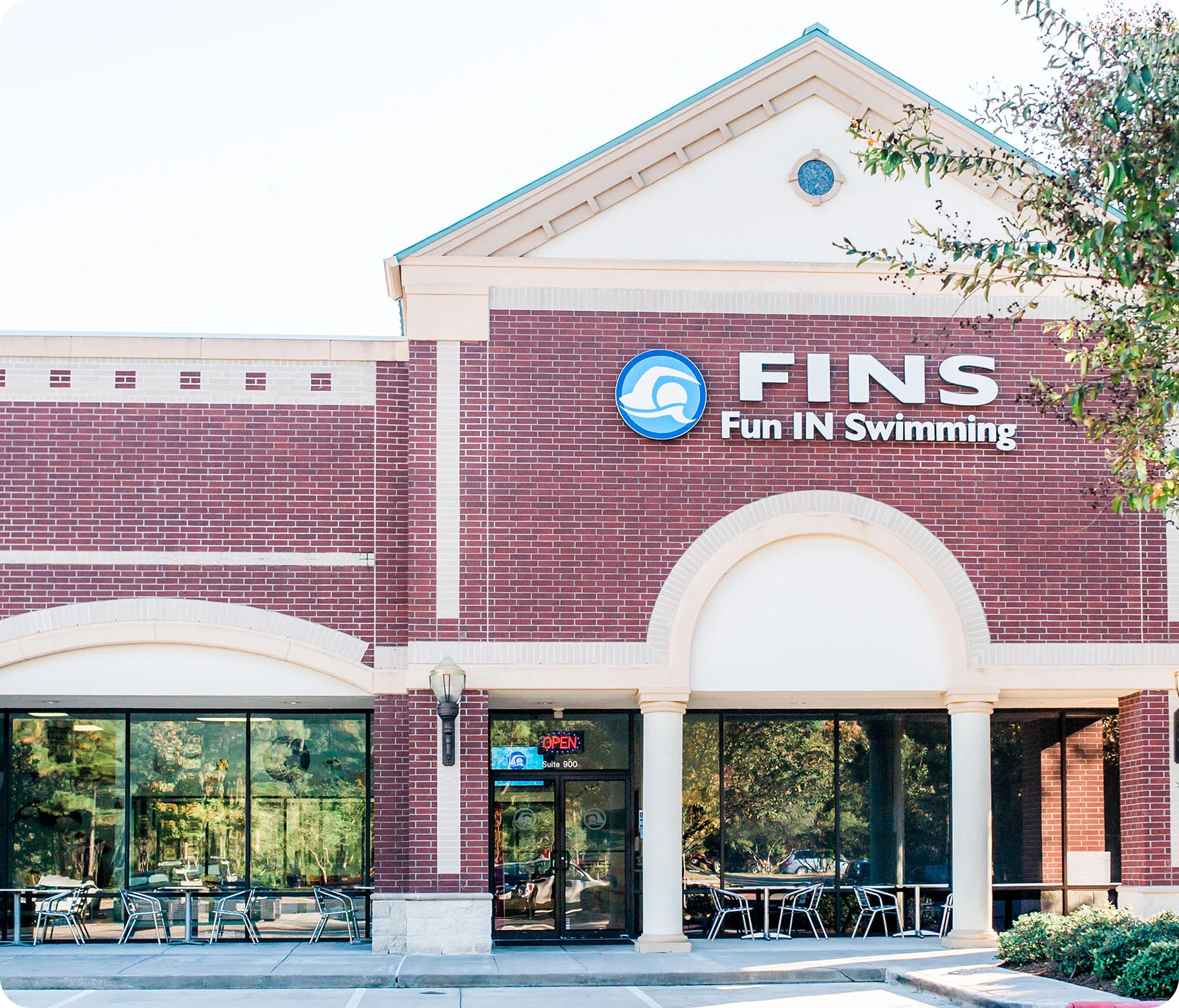 Photo gallery showing private swim activities at FINS Swim School—The Woodlands.