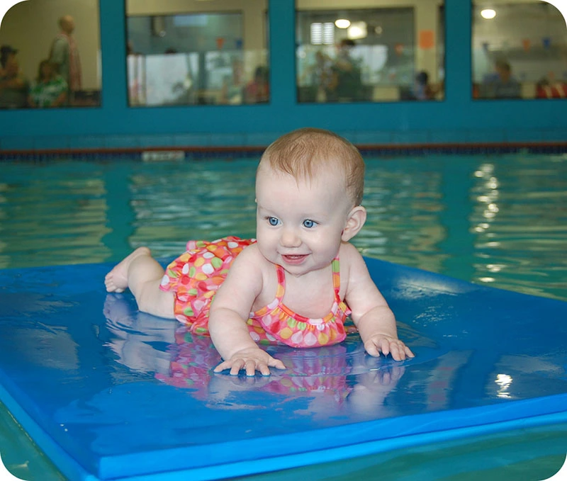 Photo gallery showing private swim activities at FINS Swim School—The Woodlands.