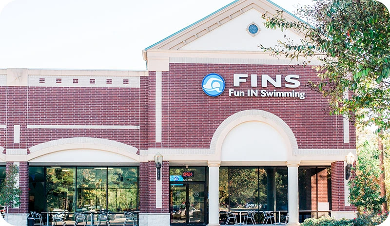 Photo gallery showing private swim activities at FINS Swim School—The Woodlands.